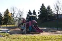 Ground-level view of Woodview Tot Lot